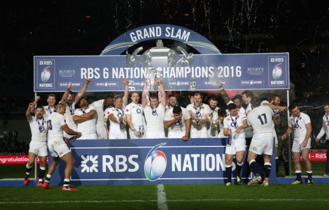 The England team celebrate winning the Grand Slam