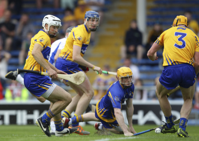 Patrick Kelly looks on as Maurice Shanahan's shot goes into the goal