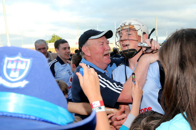 Liam Rushe celebrates with fans after the game