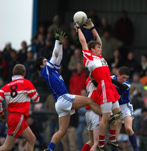 Seamie Coleman of Killybegs soars over Seamus Corcoran and Cathal Ellis of Naomh Conaill, Glenties, in the 2006 Donegal U-21 football championship. Photo courtesy of the Donegal Democrat