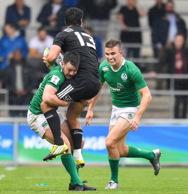 Patelesio Tomkinson is tackled by Matthew Byrne