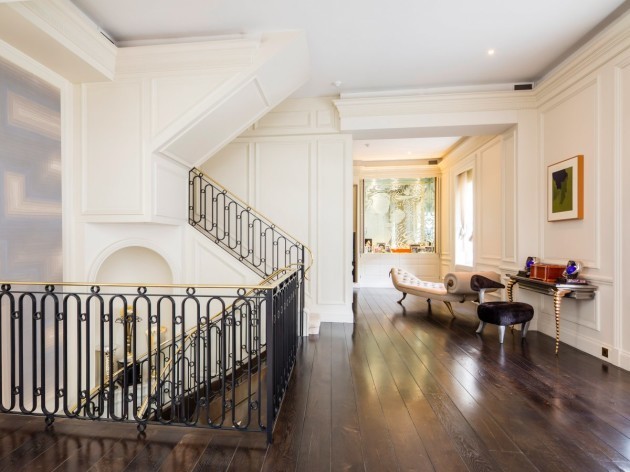 the-floor-consists-of-polished-wood-upstairs-and-maintains-the-white-colour-scheme-of-the-exterior