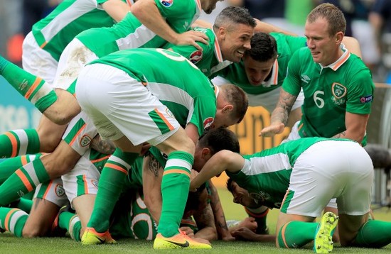 Wes Hoolahan celebrates scoring the first goal of the game with teammates