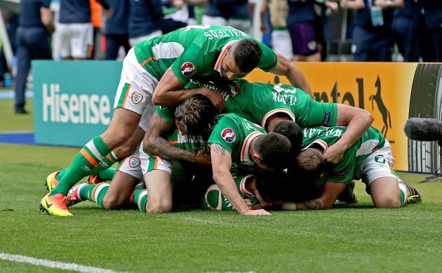 Wes Hoolahan celebrates scoring the first goal of the game with teammates