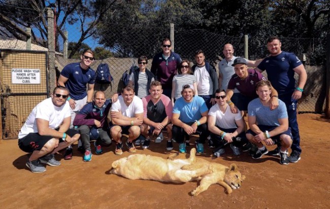 Players with lion cubs