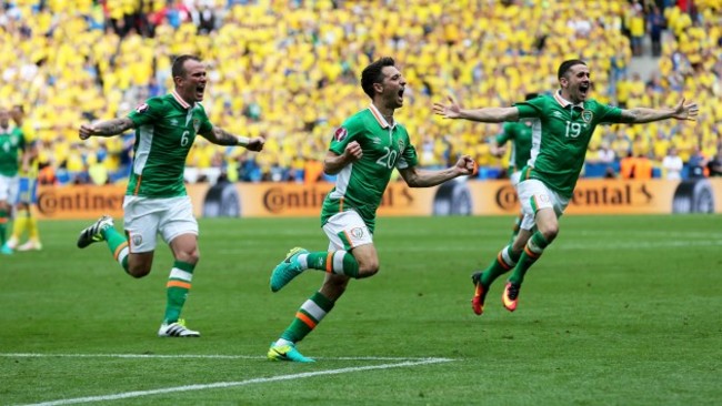 Wes Hoolahan celebrates scoring the first goal of the game with Glenn Whelan and Robbie Brady