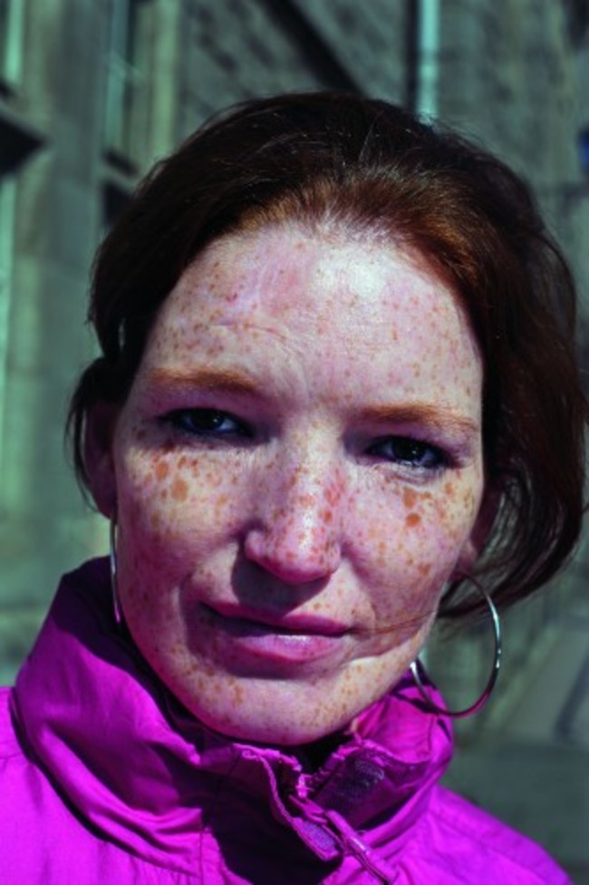 Weekend Review March 2016. Photograph from the book The Republic, by the Irish photographer Seamus Murphy, published by Allen Lane. Single use. From Celia Long (CLong@penguinrandomhouse.co.uk). Seamus Murphy's explanation of photo: Outside the Garda Station on Pearse Street, this woman walked past me with another lady. It was like one of those stories you hear about models being discovered on the street. I just had to photograph her. So I went back and blurted out about the book, and she posed for me. She was quite sad. I think she had just been crying. She had an extraordinary face.