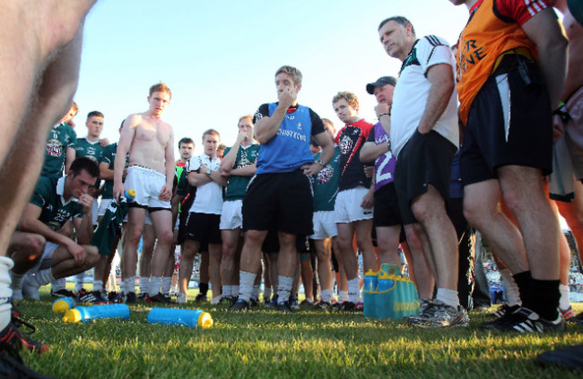 Kieran McGeeney talks to his players after the game