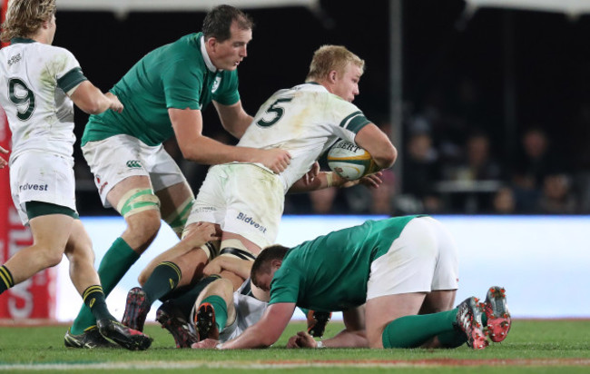 Springboks Pieter Steph du Toit  is tackled by Ireland’s Devin Toner and Tadhg Furlong