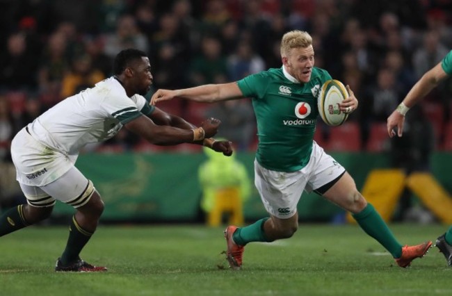 Ireland’s Stuart Olding is tackled by Springboks Siya Kolisi