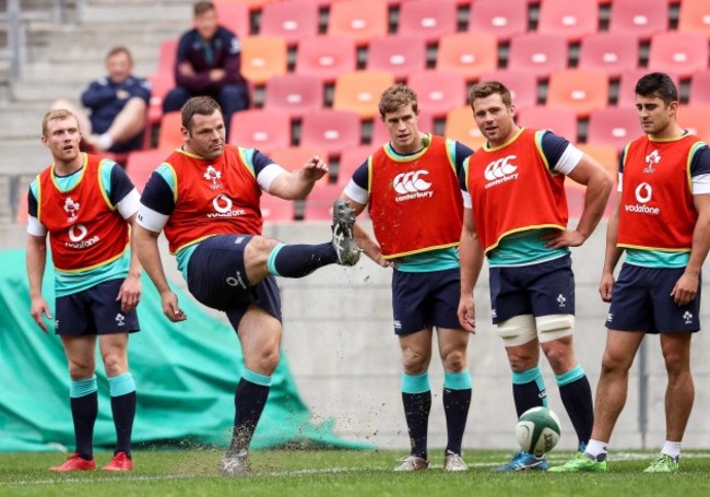 Mike Ross is watched as he attempts a kick at goal by Keith Earls, Andrew Trimble, CJ Stander and Tiernan O&rsquo;Halloran