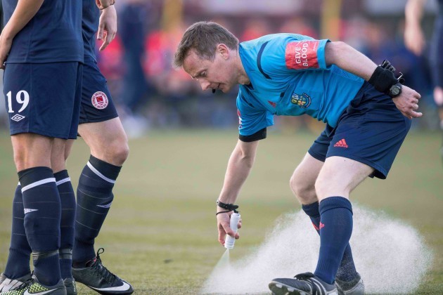 Referee Derek Tomney uses vanishing spray for the first time in the SSE Airtricity League