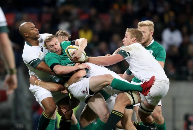 Keith Earls is tackled by JP Pietersen and Pieter Steph du Toit