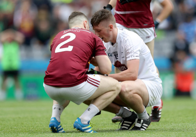 Jamie Gonoud consoles Neil Flynn after the game