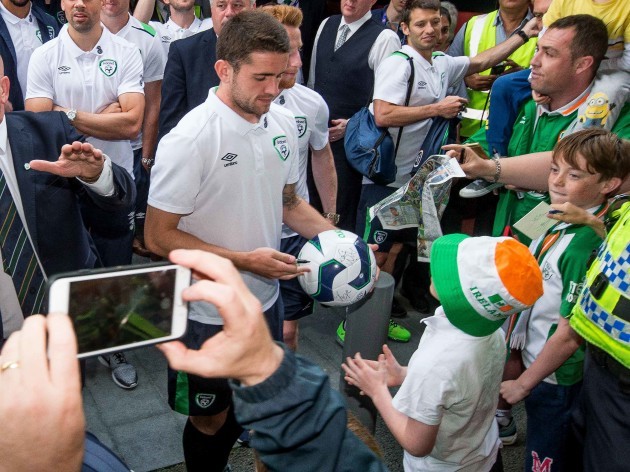 Robbie Brady signs autographs for supporters