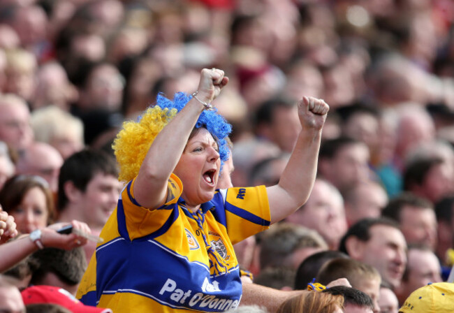 A Clare supporter celebrates a score