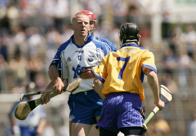 Seamus Prendergast hold's back John Mullane after a tussle with Patrick Donnellan