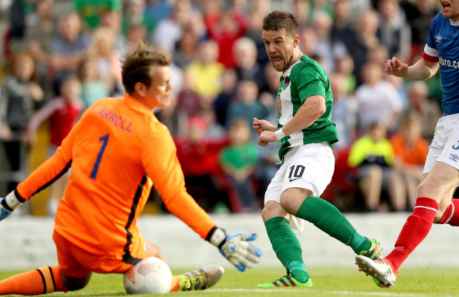 Steven Beattie has his hot saved by goalkeeper Roy Carroll