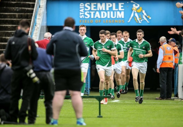 Limerick players arrive out for the start of the match