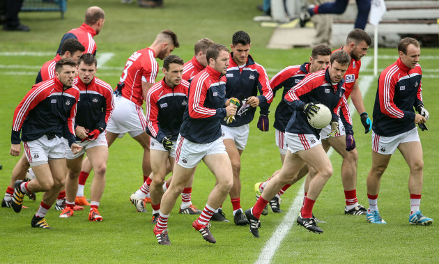 Colm O'Neill and the Cork team arrive out for the start of their warm up