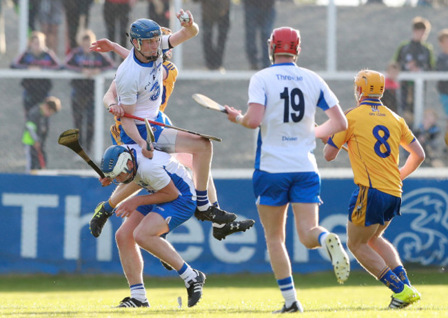 Austin Gleeson wins a ball over Míchéal Harney