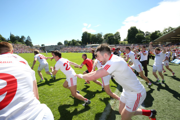 Tyrone players celebrate at the final whistle