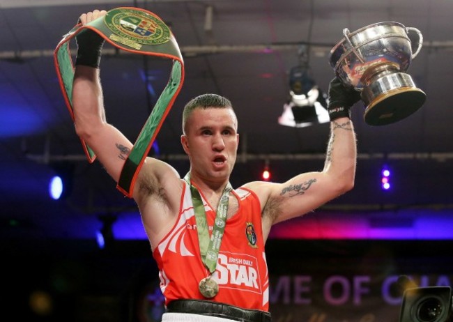 David Oliver Joyce celebrates with the trophy and belt