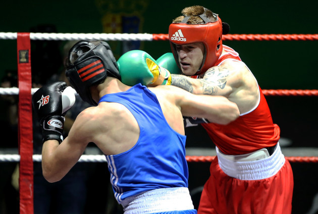 Steven Donnelly (red) in action against Khariton Agrba (blue)