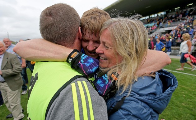 Podge Collins celebrates with his father Colm and his mother Katherine