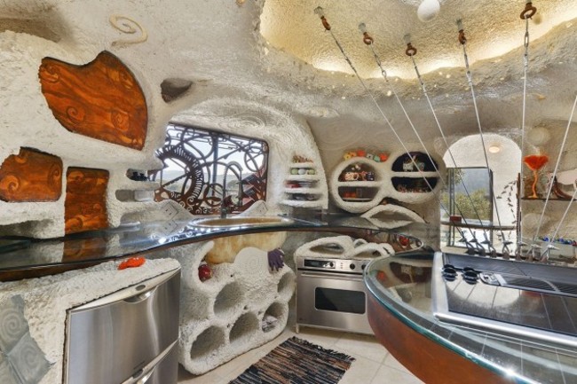 the-kitchen-features-a-center-island-attached-to-the-roof-of-the-house-which-also-features-a-skylight