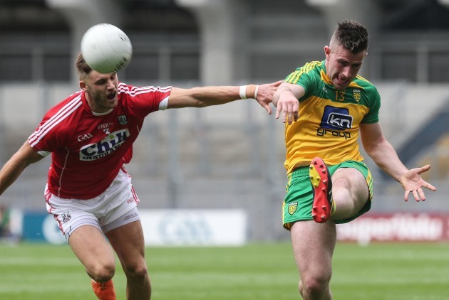 Donegal's Paddy McBrearty goes up against Cork's Eoin Cadogan