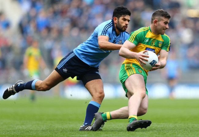 Patrick McBrearty is tackled by Cian O&Otilde;Sullivan