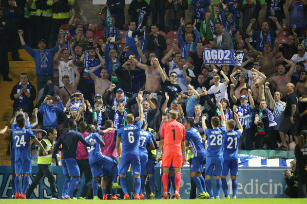 Genk players celebrate with their supporters