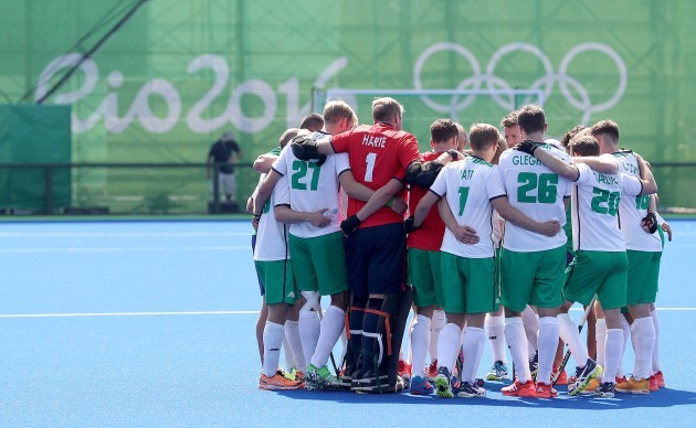 The Ireland team dejected in a huddle after the game