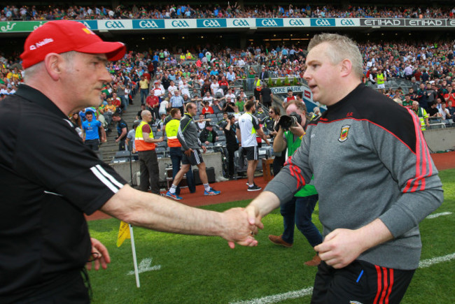 Mickey Harte and Stephen Rochford shake hands after the game