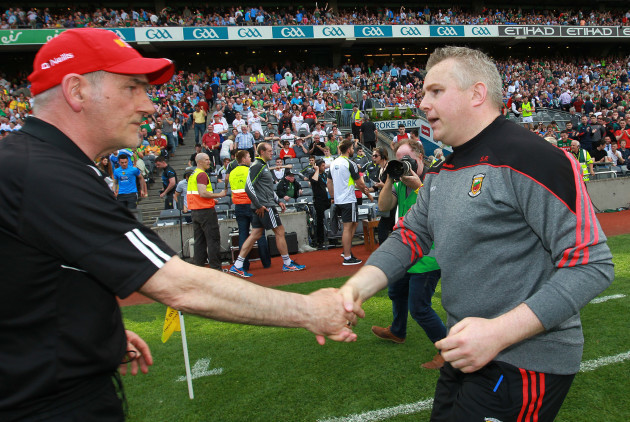 Mickey Harte and Stephen Rochford shake hands after the game