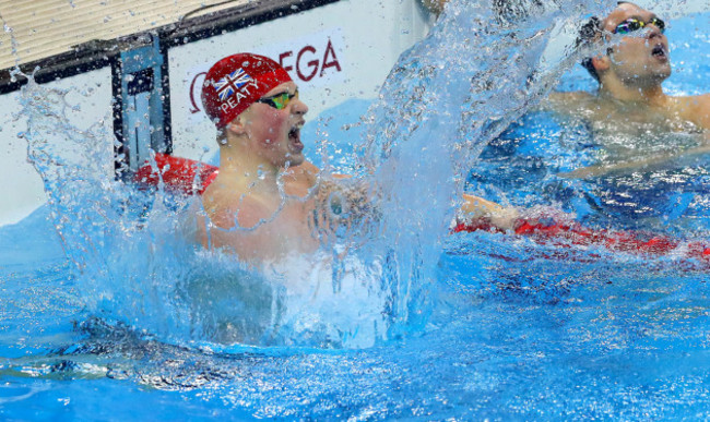 Adam Peaty celebrates winning gold