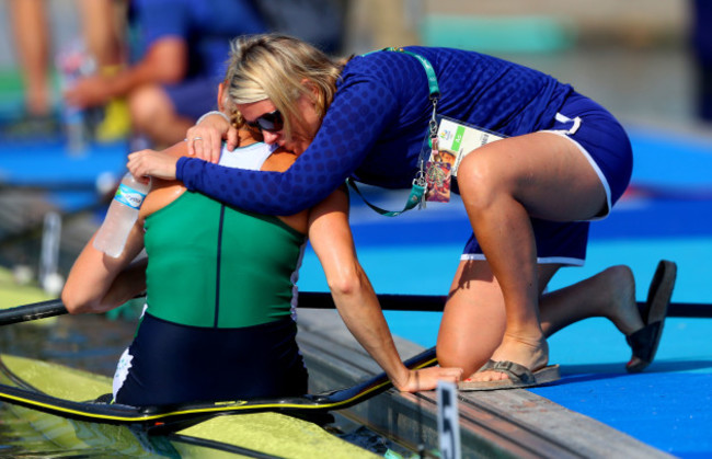 Sanita Puspure is consoled by Sarah Jane McDonnell after finishing fourth