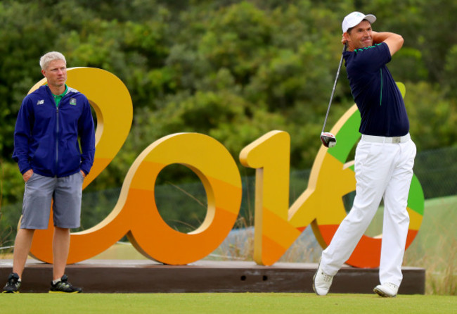 Ronan Flood looks on as Padraig Harrington takes his tee shot