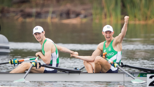 Paul and Gary O'Donovan celebrate winning a silver medal with father Teddy