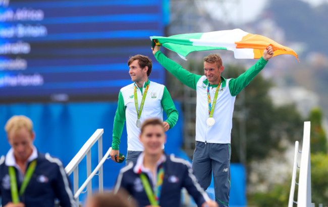 Gary and Paul O'Donovan celebrate winning a silver medal