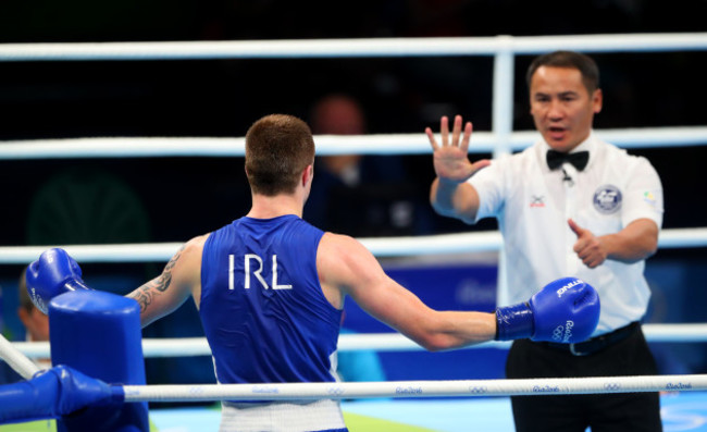 Steven Donnelly is counted out by the referee after his trip