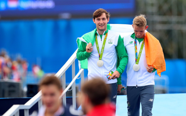 Gary and Paul O'Donovan celebrate winning silver medals