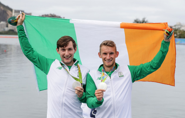 Paul and Gary O'Donovan celebrate with their silver medals