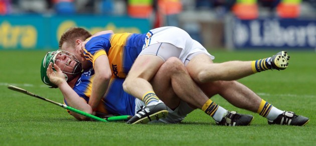 Noel McGrath and John O'Dwyer celebrate at the final whistle