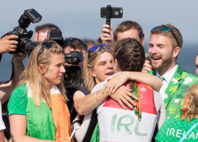 Annalise Murphy celebrates winning silver with brother Finn, mother Cathy McAleavey and sister Claudine