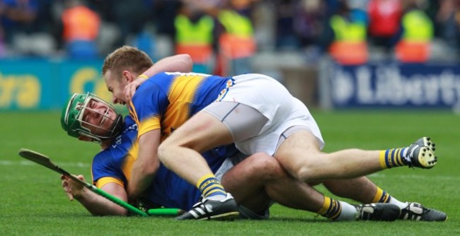 Noel McGrath and John O'Dwyer celebrate at the final whistle