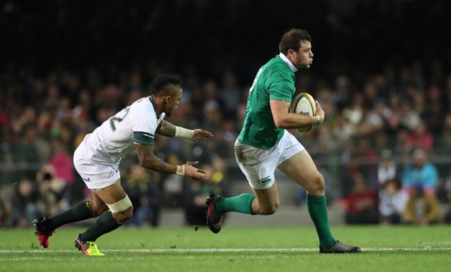 Ireland’s Robbie Henshaw is tackled by Springboks Elton Jantjies