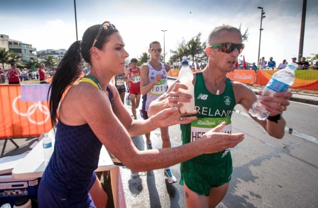 Ireland's Rob Heffernan receives water from his wife Marian