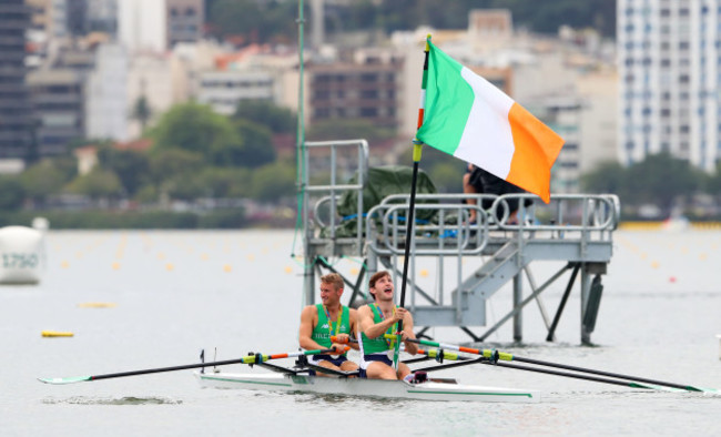 Gary and Paul O'Donovan celebrate winning silver medals